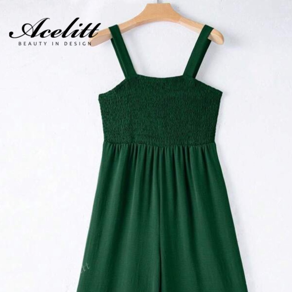 Striking Green Jumpsuit with Flowing Silhouette and Gathered Waist